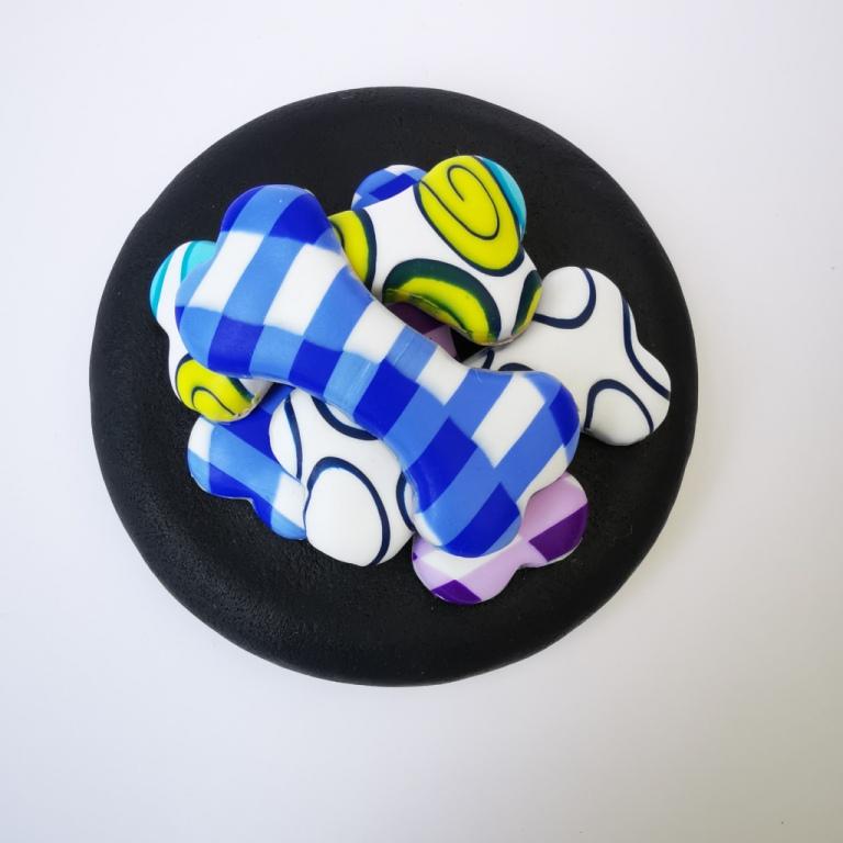 Square Dog glass treat Jar hand-decorated in New Zealand,  with a polymer clay WOOF on the front, and a pile of  funky brightly decorated polymer clay bones on the air-tight lid, ideal as a gift for that special dog