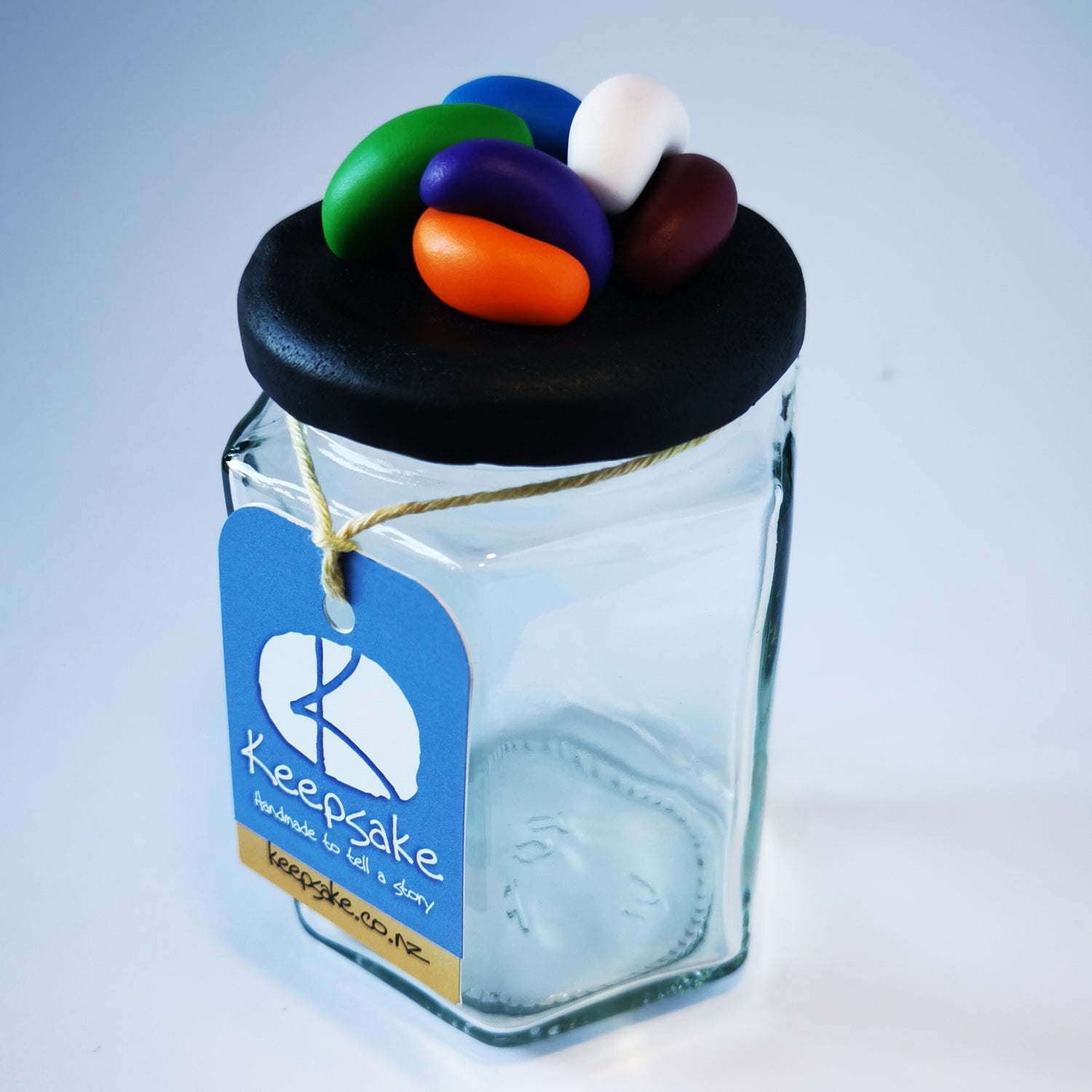 185ml glass hexagonal  jar and lid hand-decorated in New Zealand, with  an air-tight lid decorated with polymer clay jelly beans. Ready to be filled with jelly beans, sweets or other treasures.