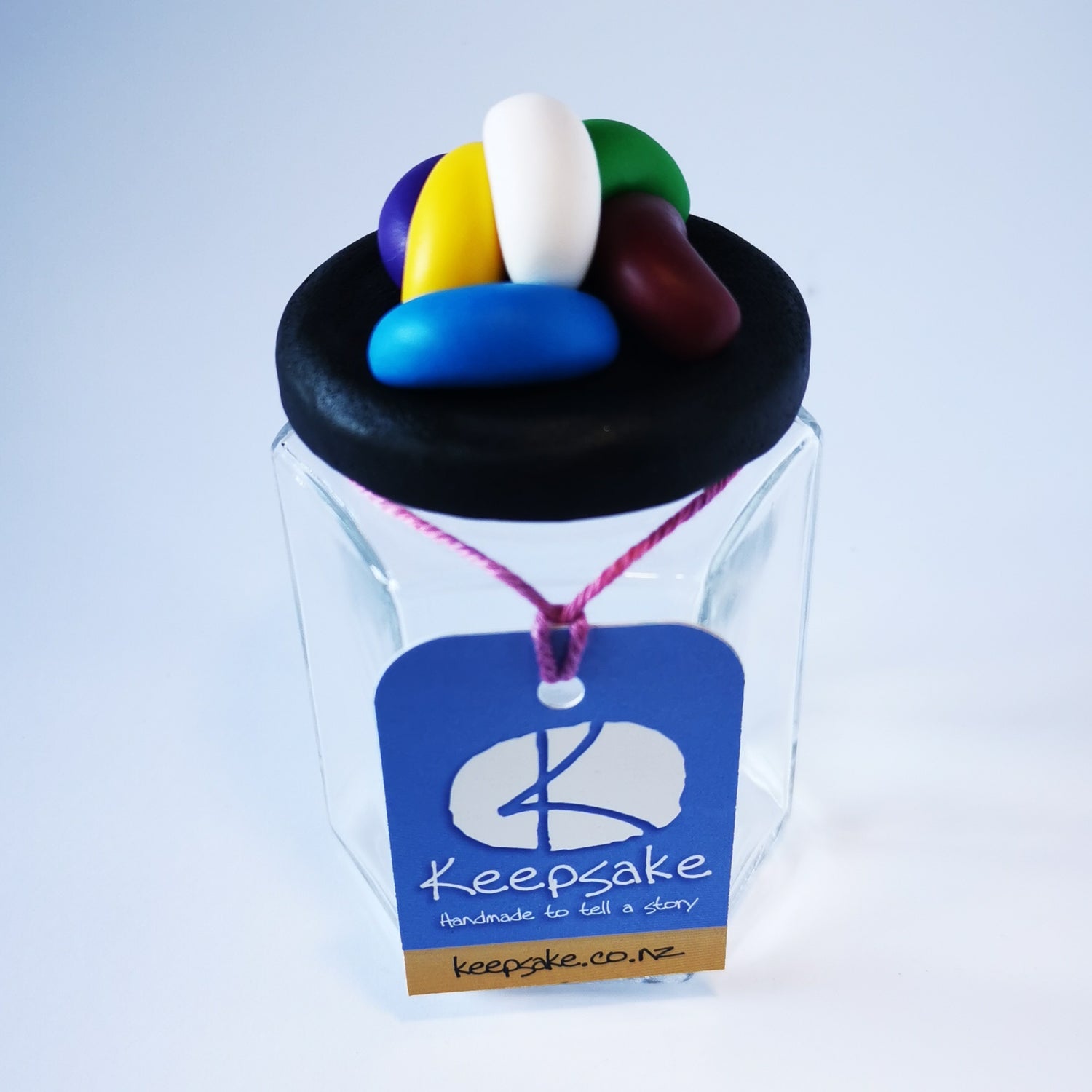 270ml glass hexagonal  jar and lid hand-decorated in New Zealand, with  an air-tight lid decorated with polymer clay jelly beans. Ready to be filled with jelly beans, sweets or other treasures.