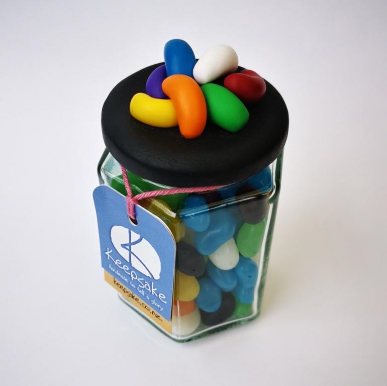 270ml glass hexagonal lolly jar hand-decorated in New Zealand, with  an air-tight lid decorated with polymer clay jelly beans. Filled with jelly beans
