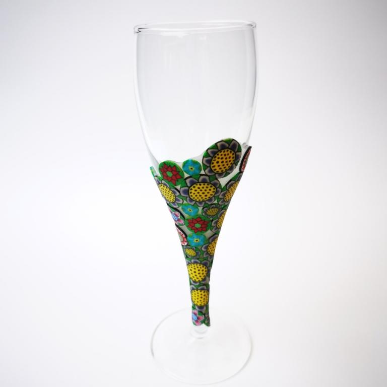 Champagne flute wine glass hand-decorated in New Zealand,  with a polymer clay veneer of funky, colourful,  flowers for a gift, wedding or special birthday.