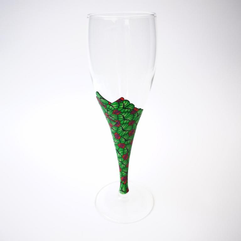 Champagne flute wine glass hand-decorated in New Zealand,  with a polymer clay veneer of red ladybird and green leaf pattern for a gift, wedding or special birthday.