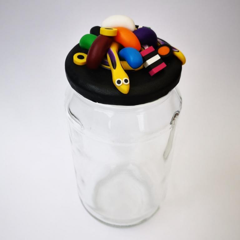 Extra-large glass treat jar hand-decorated in New Zealand, with an air-tight lid decorated with colourful polymer clay licorice allsorts, jelly beans and a yellow snake. Perfect for the whole family or as a gift for Nana or Granddad.