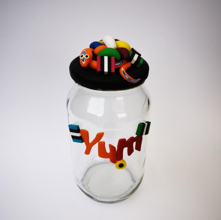 Extra-large glass treat jar hand-decorated in New Zealand, with an air-tight lid decorated with colourful polymer clay licorice allsorts, jelly beans and a red snake. Perfect for the whole family or as a gift for Nana or Granddad.