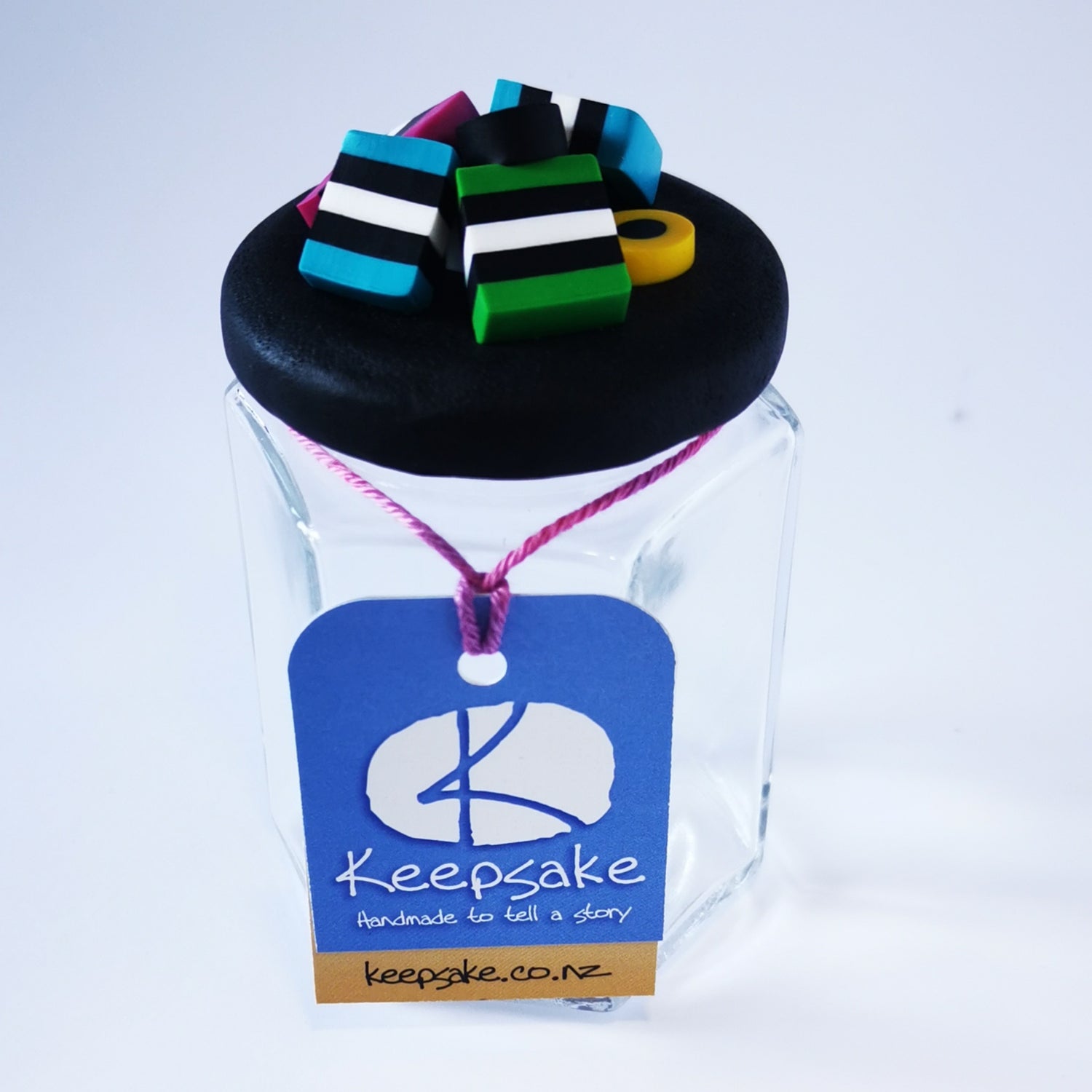 185ml glass hexagonal  jar and lid hand-decorated in New Zealand, with  an air-tight lid decorated with polymer clay licorice allsorts. Ready to be filled with licorice allsorts, sweets or other treasures.