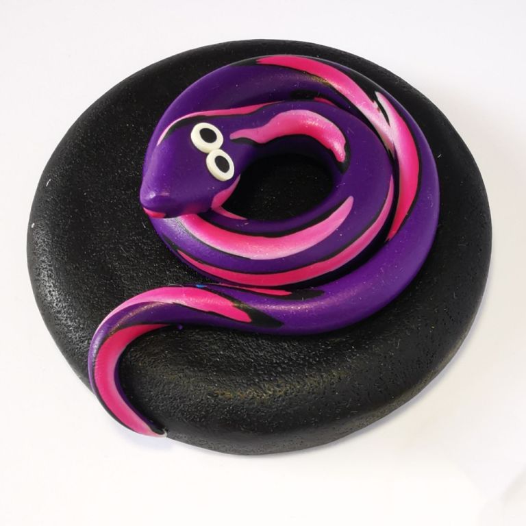 270ml glass hexagonal lolly jar hand-decorated in New Zealand, with  an air-tight lid decorated with a purple polymer clay snake. Filled with snake lollies