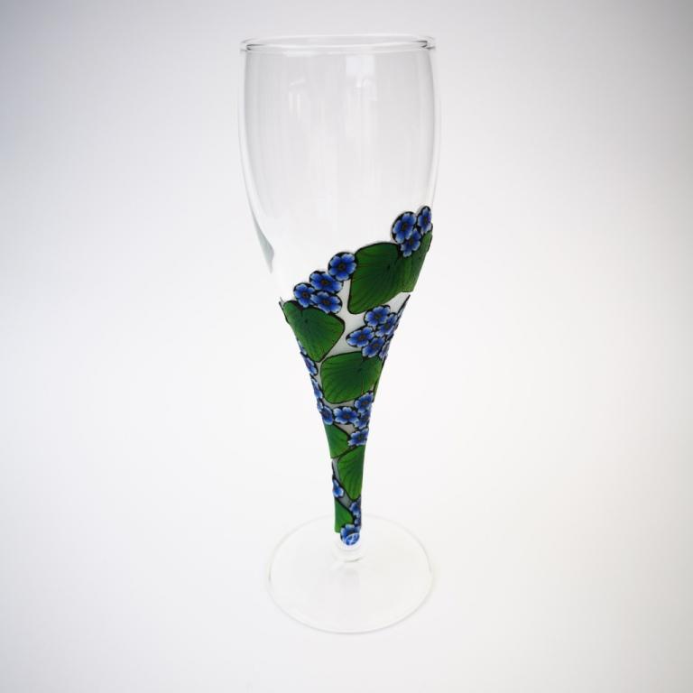 Champagne flute wine glass hand-decorated in New Zealand,  with a  polymer clay veneer of blue Chatham Island Forget-me-nots for a gift, wedding or special birthday.