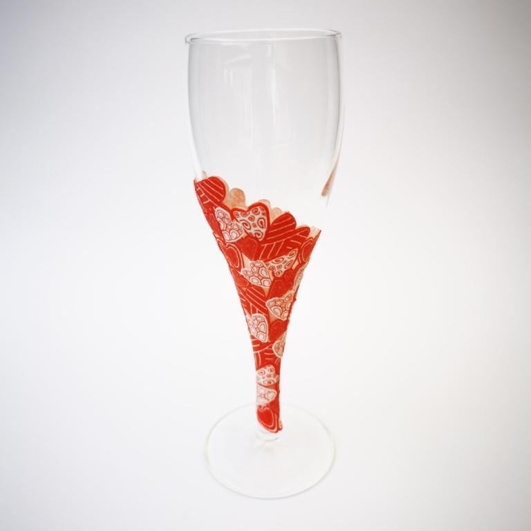 Champagne flute wine glass hand-decorated in New Zealand,  with a  polymer clay veneer of red hearts for a gift, wedding or special birthday.