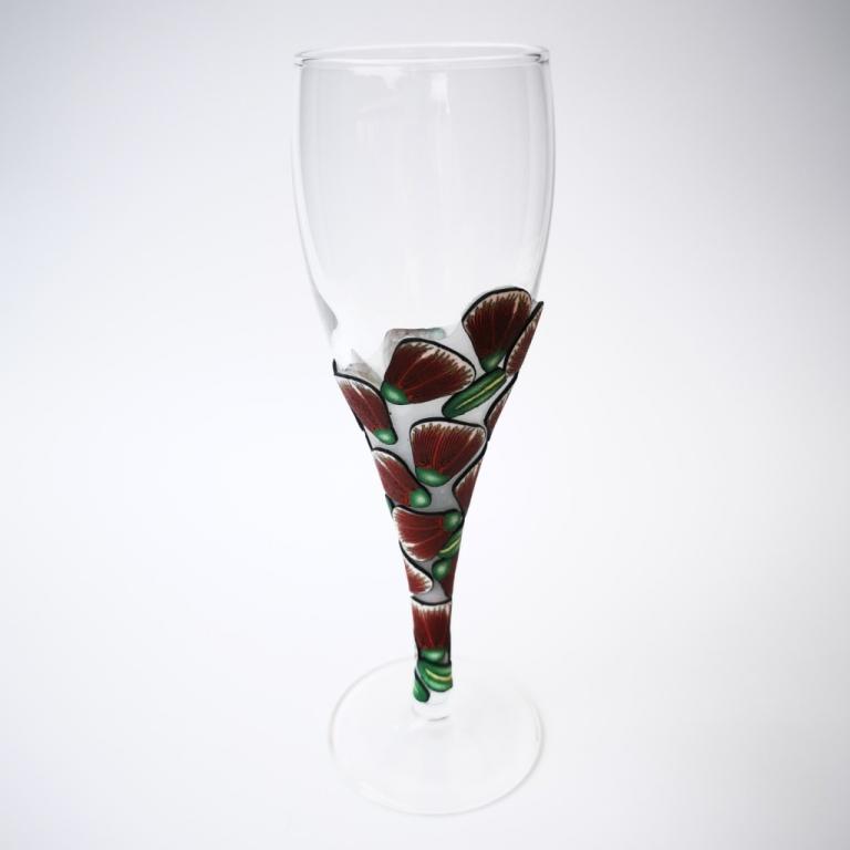 Champagne flute wine glass hand-decorated in New Zealand,  with a polymer clay veneer of  pohutukawa flowers for a gift, wedding or special birthday.